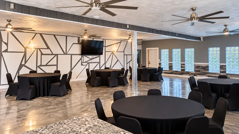 The Cloud Room: geometric mural wall with a wall-mounted TV