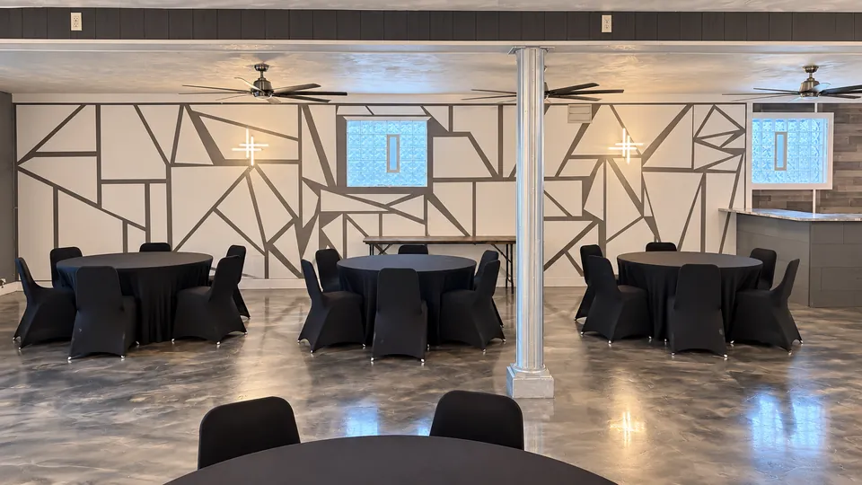 The Cloud Room: round tables along the mural wall