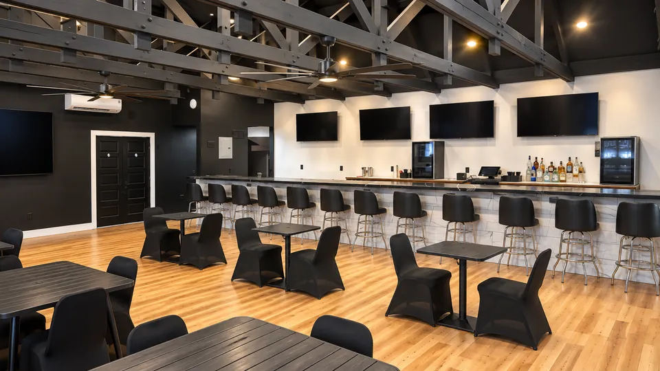 The Main Bar: the long bar with four TVs, stools and dining tables