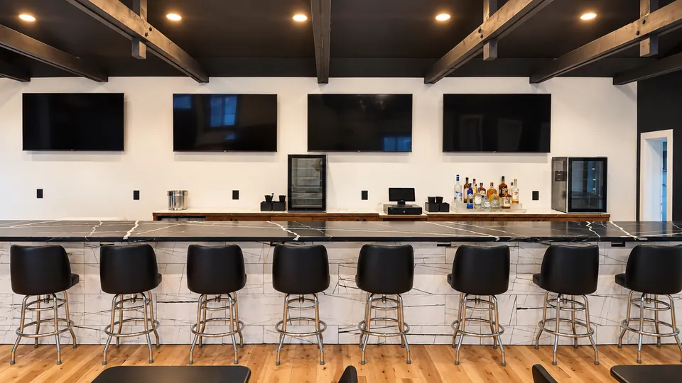 The Main Bar: the bar straight on, with four TVs above it